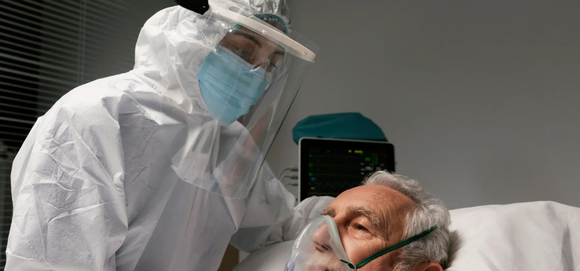 elderly-man-with-respirator-hospital-bed